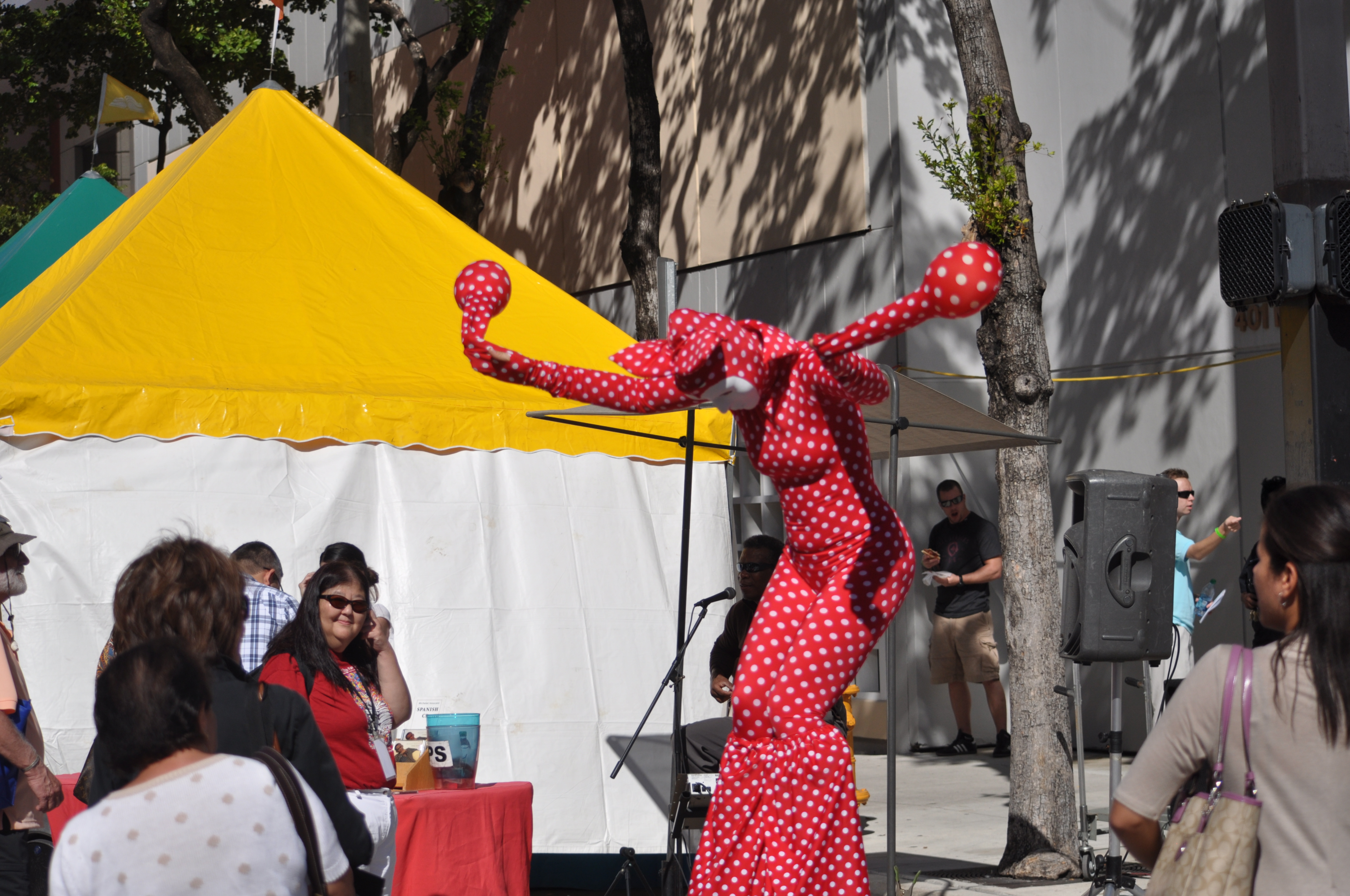 A stilt walker entertains visitors at the 2012 Miami Book Fair.